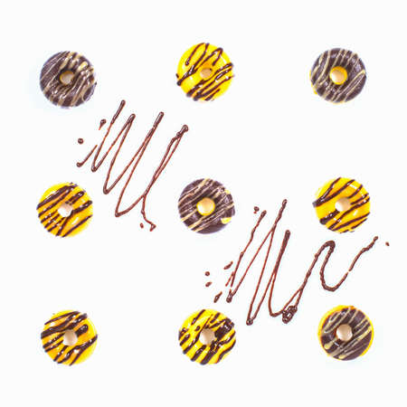 Homemade Glazed Donuts with decor on the white background. Top view.の写真素材