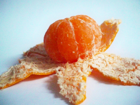 fresh juicy tangerine and peel on white backgroundの写真素材