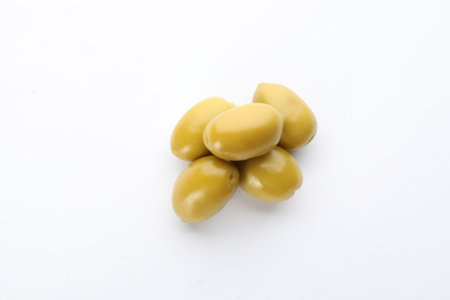 Pile of green olives o white background, top view