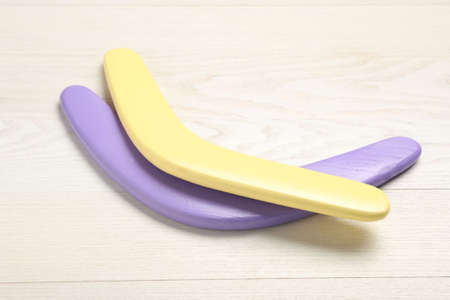 Color boomerangs on white wooden backgroundの写真素材