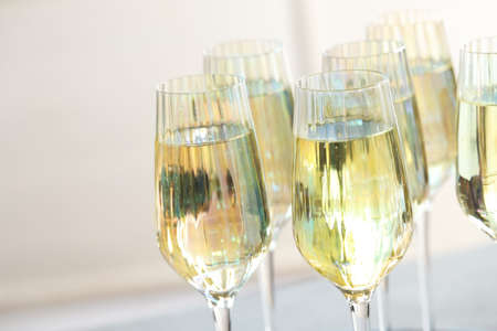 Group of expensive champagne glasses on light background, closeupの写真素材