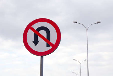 street lamps and road sign and grey skyの写真素材
