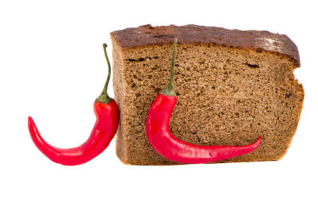 isolated on white bread slice and two red peppersの写真素材