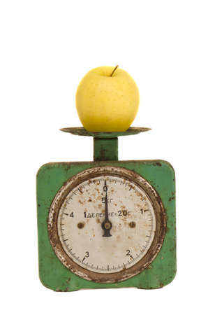 isolated vintage and grunge scale with one yellow appleの写真素材