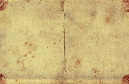ancient and grungy postcard paper backgroundの写真素材
