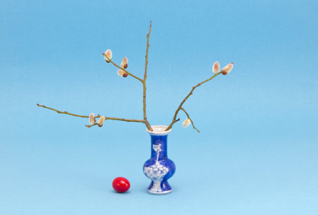 easter time vase with red egg and pussy-willow