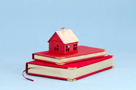 business diary and house symbol on azure backgroundの写真素材