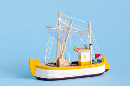small ship model on azure backgroundの写真素材