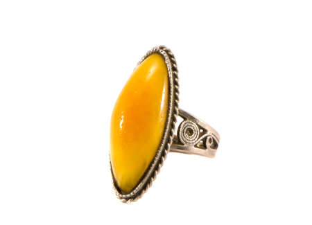 isolated on white vintage metal ring with amberの写真素材
