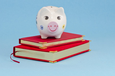 businees calendar and piggybank on azure backgroundの写真素材