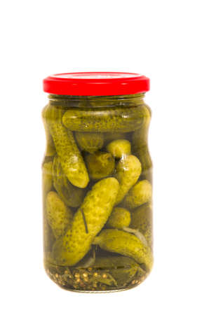 glass jar canned cucumbers isolated on whiteの写真素材