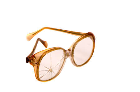 vintage and broken eyeglasses isolated on white backgroundの写真素材