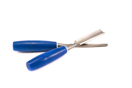 two new woodcarving tools isolated on whiteの写真素材