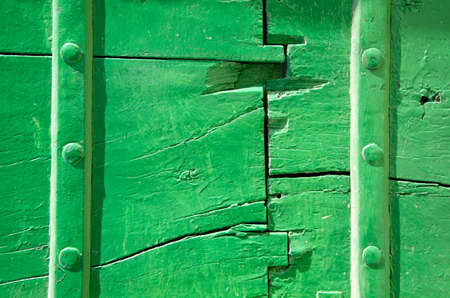 old green door fragment background and textureの写真素材