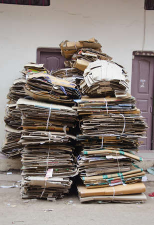 waste paper cardboard for recycling in India city street の写真素材
