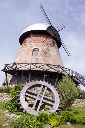 historical windmill and old wooden wheel