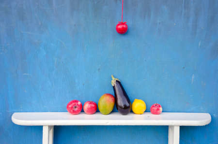 ripe fruits an vegetables on white wooden shelf. Vegetarian foodの写真素材
