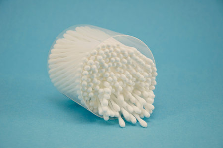 Cotton swab package for cleaning ear on blue background
