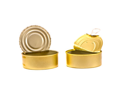 open and empty used  preserve  cans on white 