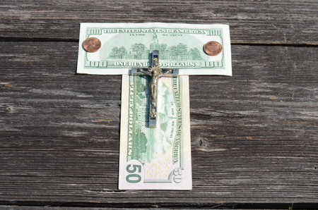 usines money and religion concept - usa dollars and crucifixionの写真素材