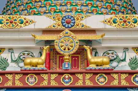 buddhist symbols art on temple in Lumbini, Nepal. Wheel and deersの写真素材