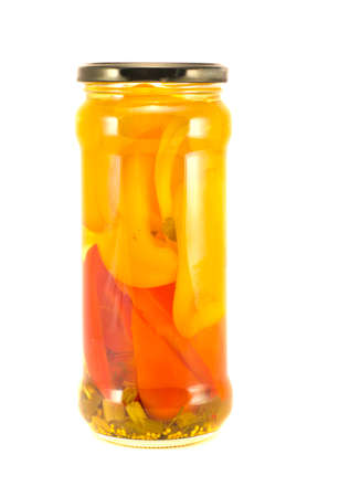 Canned sweet red and yellow pepper glass jar  isolated on whiteの写真素材
