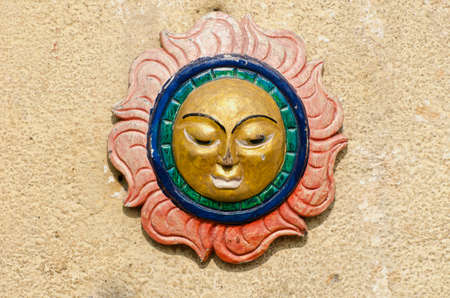 sun symbol colorful retro  mask on asia house wallの写真素材
