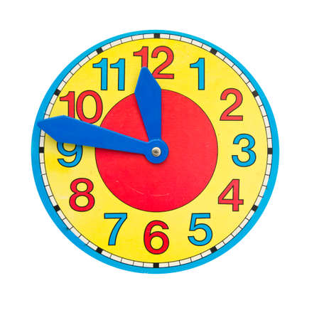 colorful decorative clock face dial toy isolated on whiteの写真素材