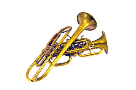 two vintage  brass wind musical instruments isolated on whiteの写真素材