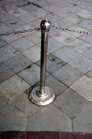steel barrier with chain in museum on floorの写真素材