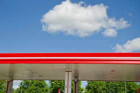 modern colorful gasoline fuel station roof and clouds