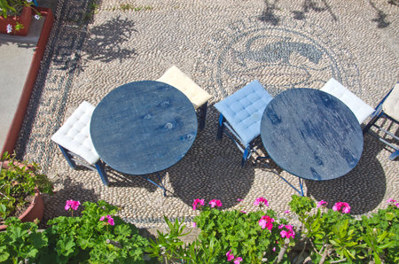 Caffe from above with stone paved pavement in Greeceの写真素材