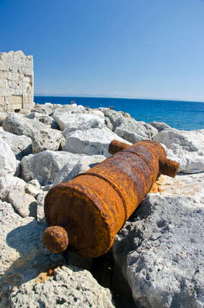 Rusty old historical cannon in Rhodes island near fort, Greeceの写真素材