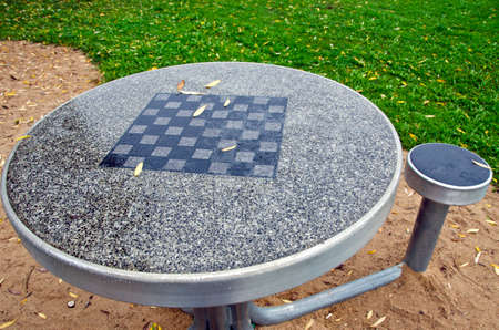 Table with chess board and chairs in the city parkの写真素材