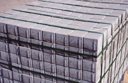 Stack of cement bricks tied with plastic