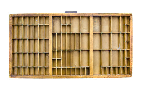 Partitioned antique wooden drawer shelf isolated on white