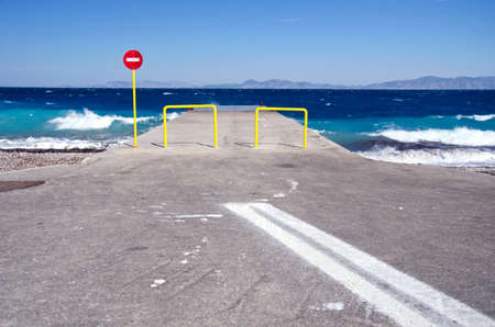 Pier and car parking lot by the sea in Rhodos, Greeceの写真素材