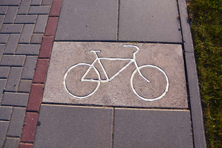 Bicycle track with unique sign on pavement in parkの写真素材