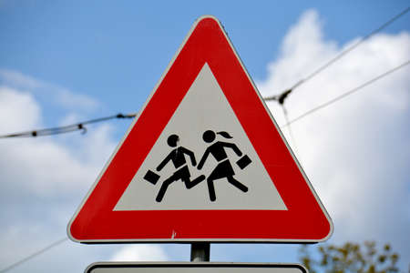 European school road sign on cloudy sky backgroundの写真素材