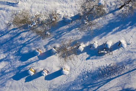 beehives covered with snow in winter, aeriaL viewの写真素材