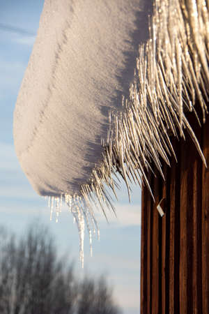 Dripping melting spring icicles, midwinter iconの写真素材