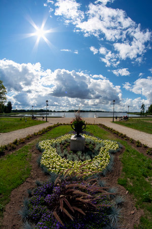 Beautiful summer time flower beds near lake in old manor park, Lithuania, fisheye viewの写真素材