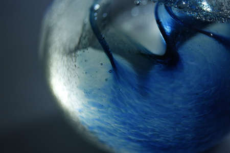 A blue glass ornament.の写真素材