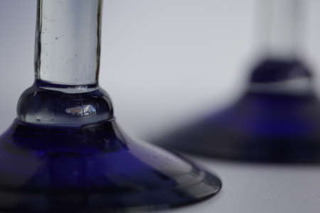 The stand part of a blue colored wine glass.の写真素材