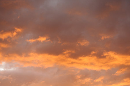 Dramatic cloudscape at sunset as a background for design.の写真素材