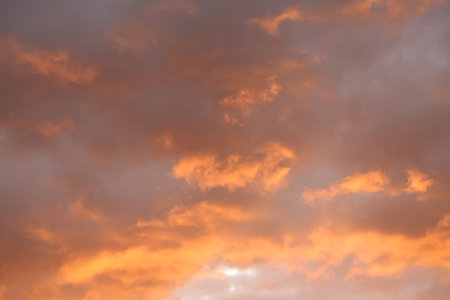 Beautiful sunset sky background. Dramatic sky with orange clouds.の写真素材