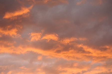 Cloudscape, Colored Clouds at Sunset near the Ocean as a Backgroundの写真素材
