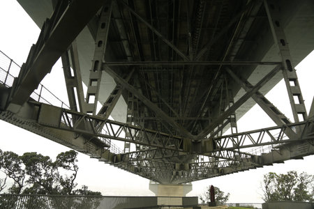 Under the Auckland harbor bridge, close-up view of the suspension bridge.