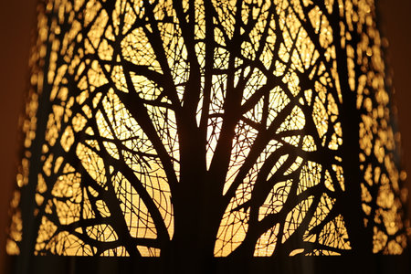 A close up of a tree pattern on a lamp shade.の写真素材