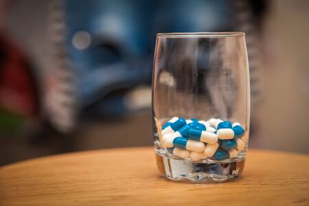 Drugs in the wineglassの写真素材